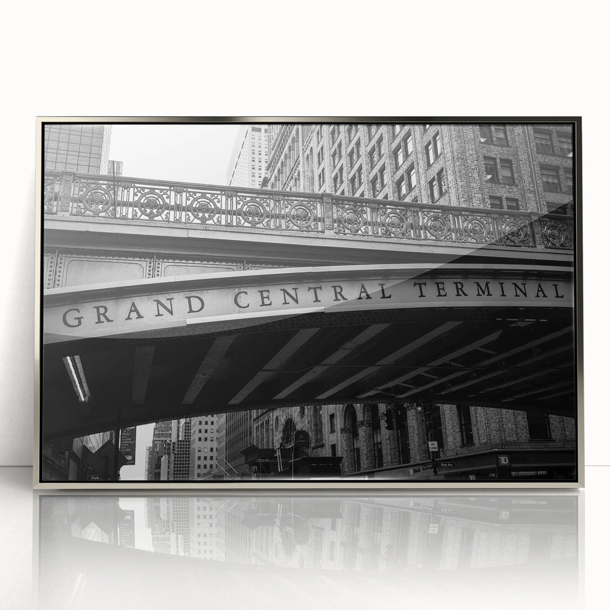 Mid-century modernist art of NYC's Grand Central in silver framed acrylic, featuring muted gray tones.