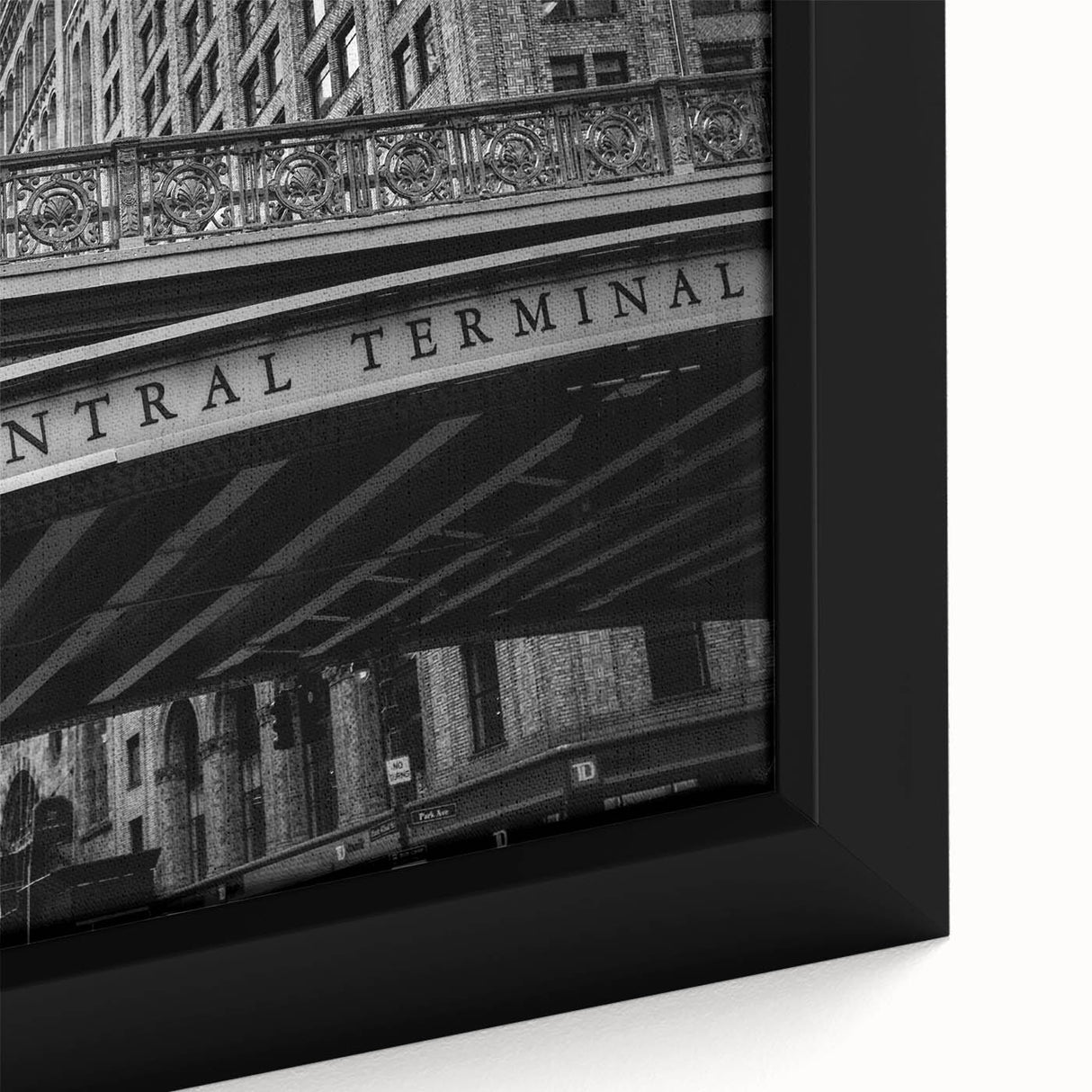 Black wall art featuring a textured depiction of Grand Central Station in vibrant, colorful tones on a framed canvas.
