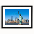 Abstract art print featuring a colorful rendition of the Statue of Liberty, set in a black frame with mat.
