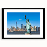 Abstract art print featuring a colorful rendition of the Statue of Liberty, set in a black frame with mat.