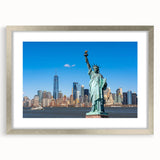 Textured art print of the Statue of Liberty in abstract style, with muted blue and gray tones on a framed silver mat.