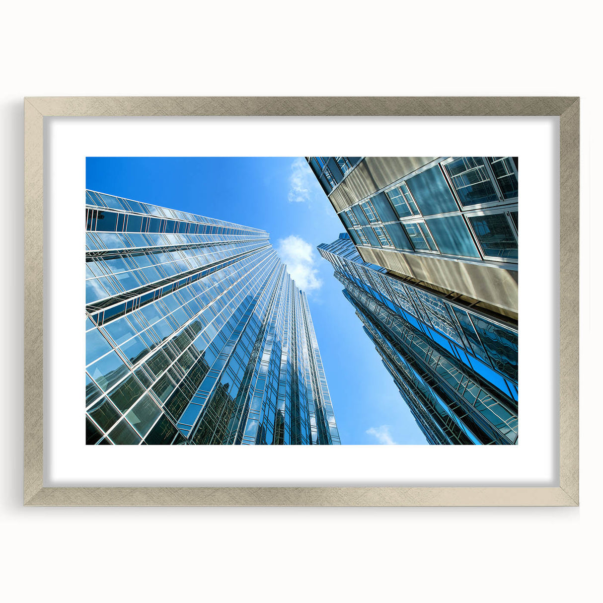 Textured art print of Pittsburgh skyline in muted gray and blue tones on a framed silver mat, suitable for bedroom decor.