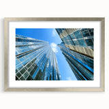 Textured art print of Pittsburgh skyline in muted gray and blue tones on a framed silver mat, suitable for bedroom decor.