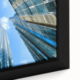 Extra large framed canvas of Pittsburgh skyline in black with textured, colorful accents, ideal for living room decor.