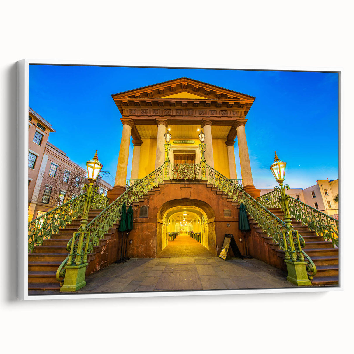Vintage poster art of Charleston, South Carolina, featuring colorful art on a white framed canvas.