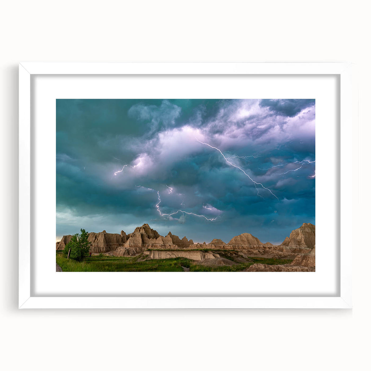 Abstract art print of South Dakota Badlands in muted earth tones on a framed white mat, suitable for dining room decor.