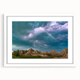 Abstract art print of South Dakota Badlands in muted earth tones on a framed white mat, suitable for dining room decor.