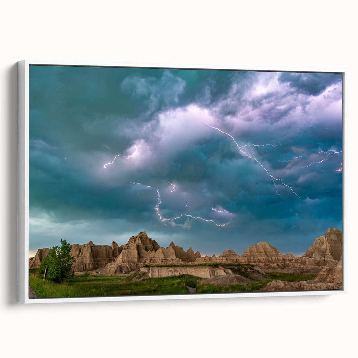 Vintage poster art of South Dakota Badlands in vibrant colors on a white framed canvas, ideal for living room decor.