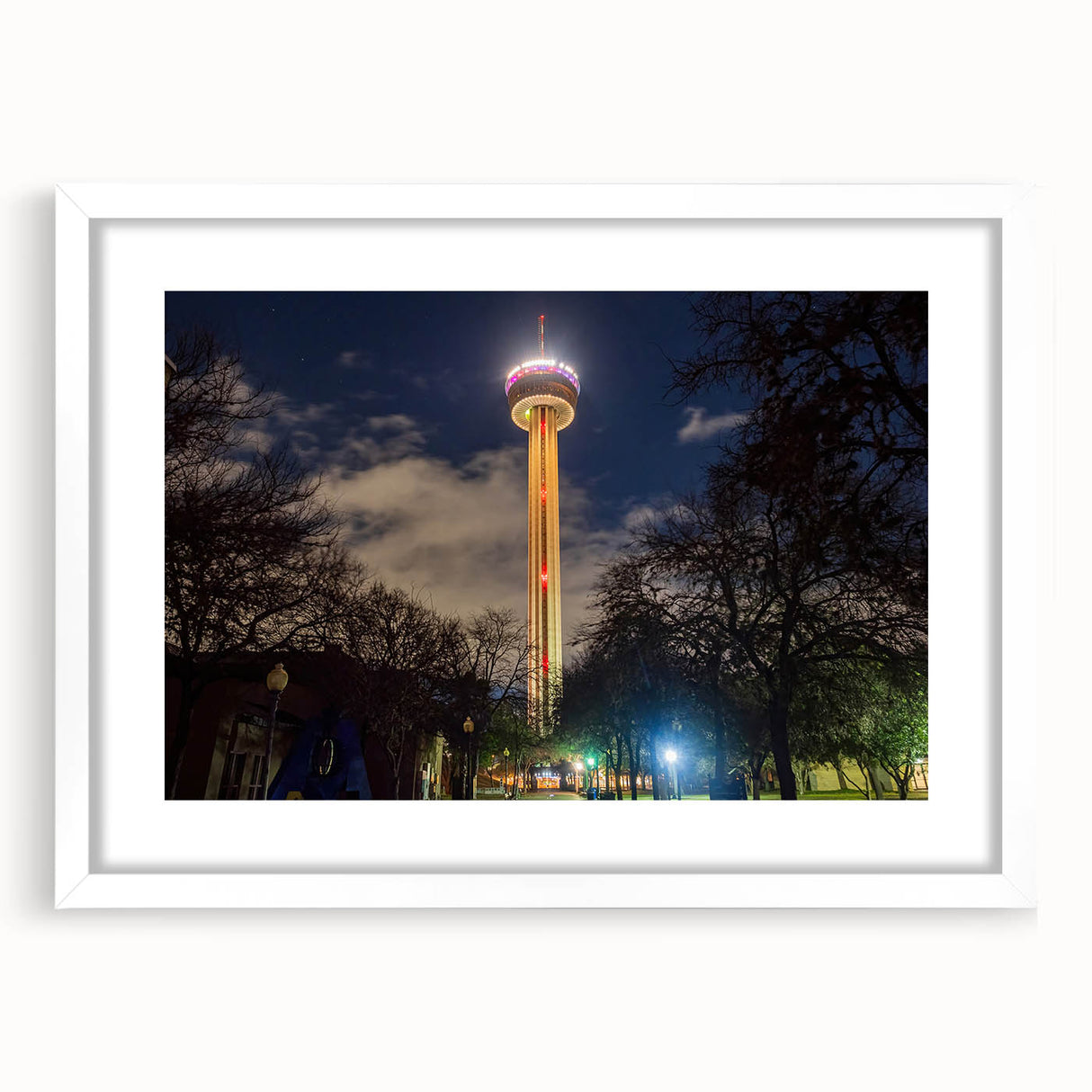 Abstract art print of San Antonio skyline in muted blue tones on a white framed canvas.