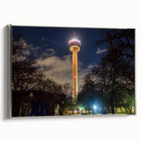 Framed canvas landscape art painting featuring the San Antonio skyline with colorful art accents on a black background.
