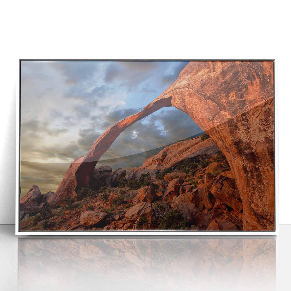 Acrylic print of Arches National Park with vibrant red and orange tones, framed in white, fitting for modern art wall decor.