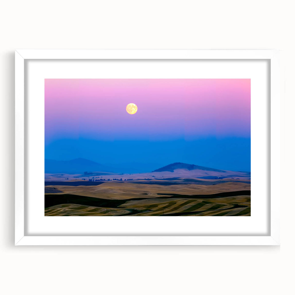 Abstract art print of Palouse, Washington in muted green and brown tones on a framed white canvas.