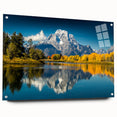 Acrylic print of the Grand Tetons with a reflective finish, showcasing earth tones, ideal for dining room or bedroom decor.