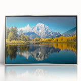 Mid-century modernist art depicting the Grand Tetons in muted earth tones, framed in silver acrylic.