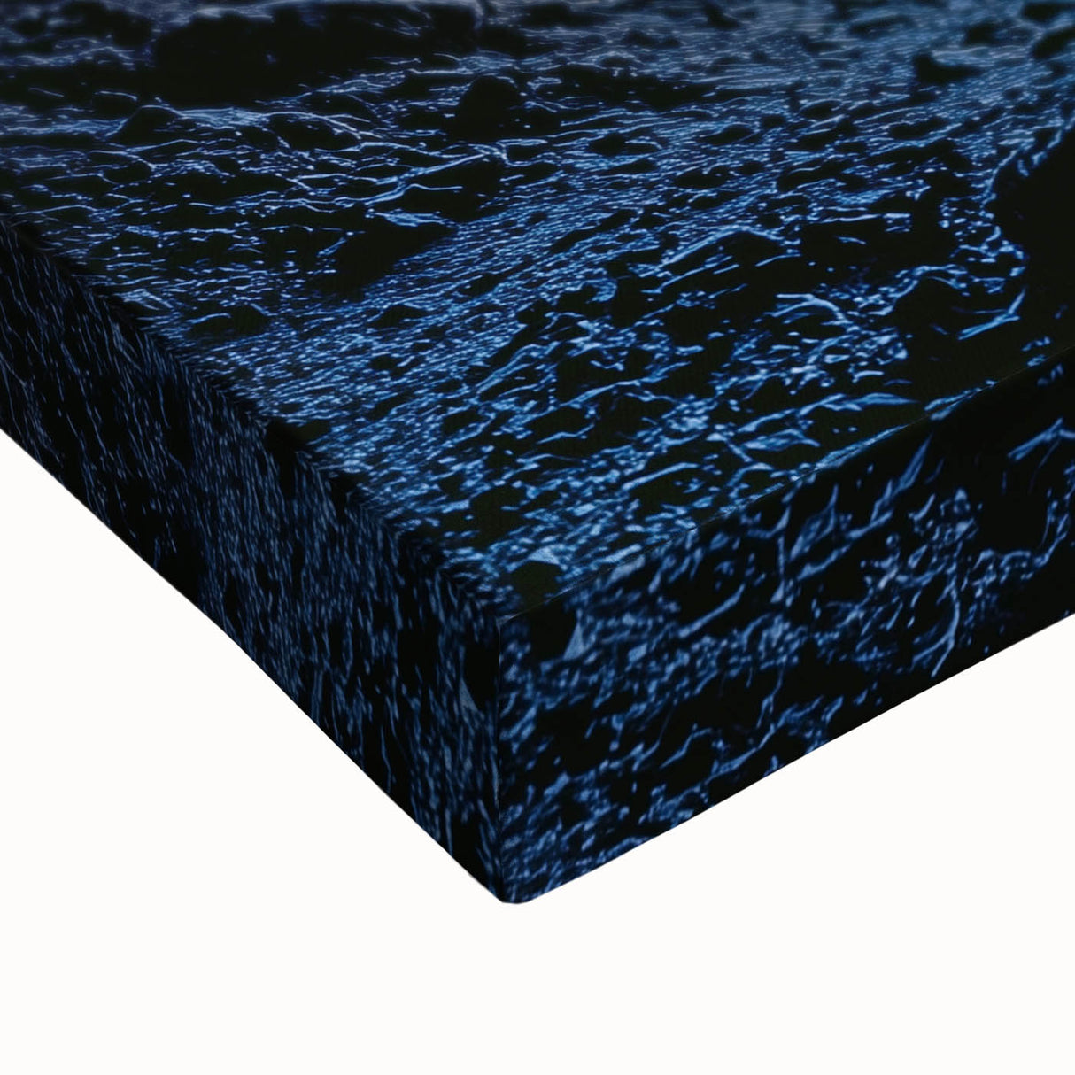Close-up of a stretched canvas print showcasing a vibrant landscape design with intricate cave patterns, featuring rich colors and textures ideal for home decor.