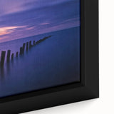 Framed canvas artwork showcasing a vibrant beach landscape with turquoise waters and golden sands, ideal for coastal home decor. This close-up highlights the textured surface and detailed brushstrokes that enhance visual depth.