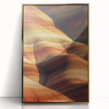 Framed acrylic artwork showcasing a desert landscape with warm golden tones, elegantly displayed in a sleek gold frame, perfect for home decor.