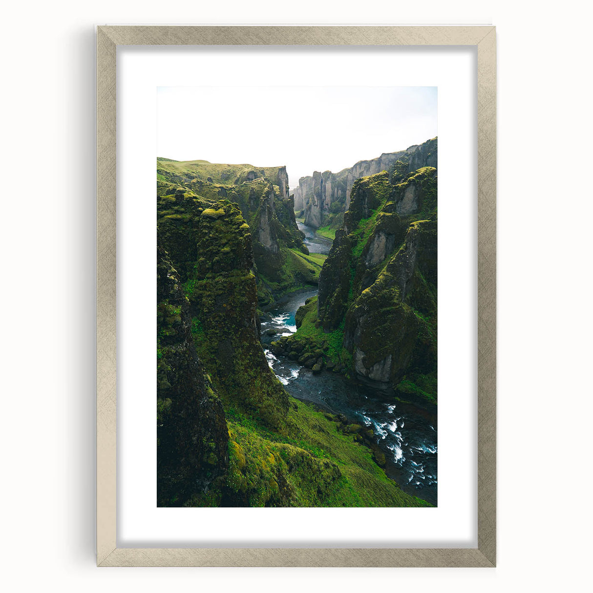 Textured abstract art print in shades of green and blue, framed in silver, ideal for bedroom wall decor.