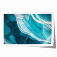 Rolled print showcasing a vibrant landscape with caves, featuring rich colors and textures, ideal for home decor, packaged securely in a cardboard tube.