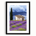 Framed landscape artwork depicting a serene countryside scene, featuring a black frame and matting, ideal for enhancing home decor aesthetics.