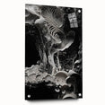 Large abstract wall art on acrylic glass featuring swirling blue and gray tones, suitable for bedroom or dining room decor.