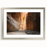 Framed silver landscape artwork showcasing intricate cave designs, mounted with a white mat for a polished look, ideal for enhancing modern home decor.