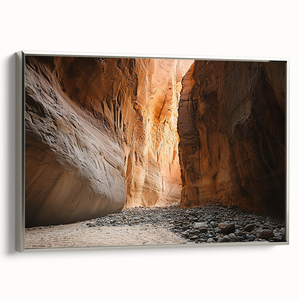Framed canvas artwork depicting a serene landscape with caves, featuring a sleek silver frame. Ideal for enhancing modern home decor with nature-inspired themes.