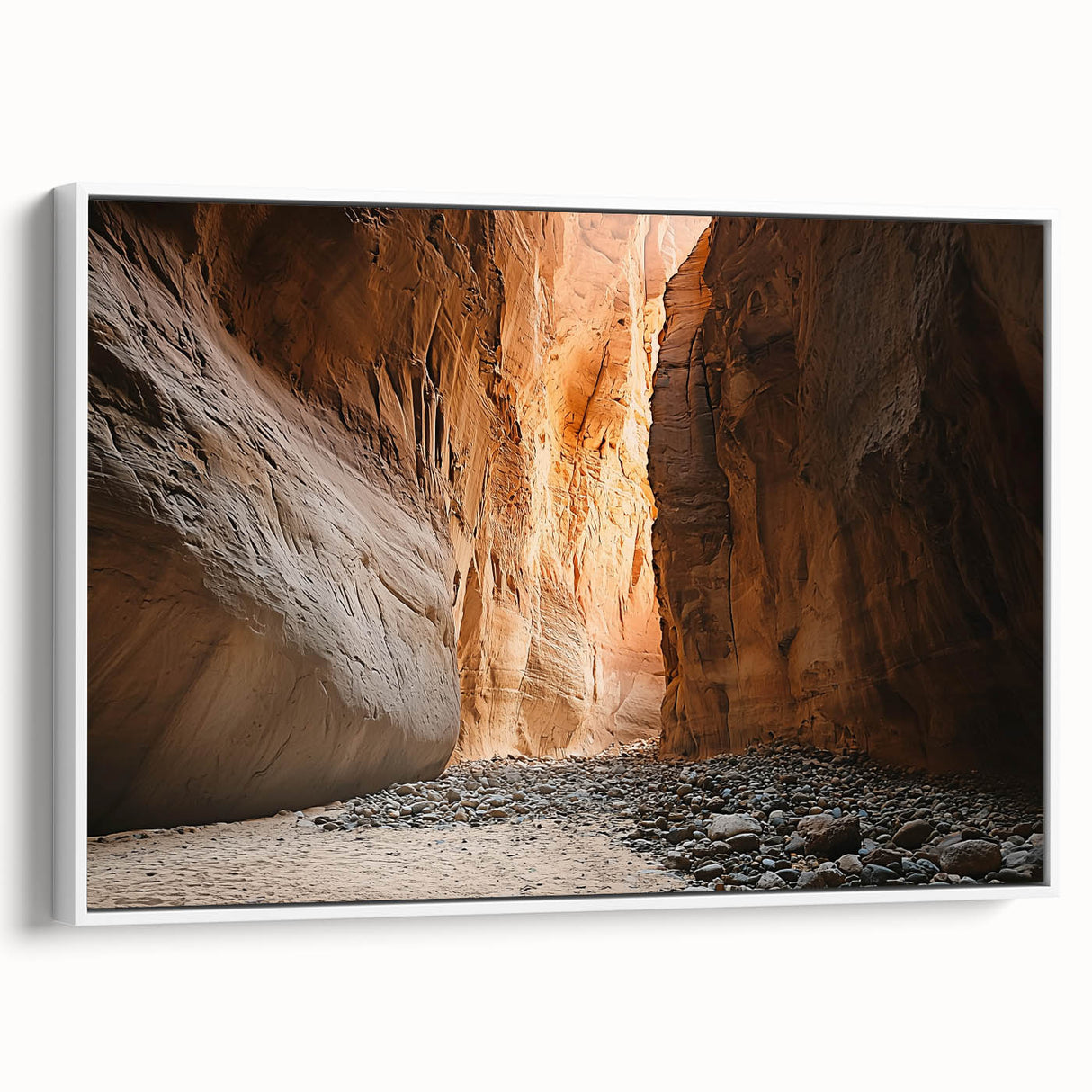 Framed canvas artwork depicting a serene landscape of caves, featuring earthy tones and intricate details, showcased with a white frame for a modern aesthetic.
