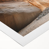 Rolled canvas showcasing a vibrant landscape scene with intricate cave designs, featuring rich colors and textures, securely packaged in a protective cardboard tube.