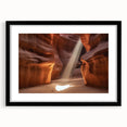 Black-framed landscape art print showcasing vibrant canyons in rich earth tones, with a white mat for added elegance, perfect for home decor enhancement.