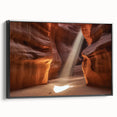 Framed canvas artwork depicting a stunning landscape of canyons, featuring earthy tones and intricate textures, with a sleek black frame enhancing its modern aesthetic. Ideal for home decor enthusiasts seeking a nature-inspired focal point.