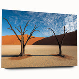 Vibrant acrylic landscape artwork depicting a serene desert scene with warm hues of orange and yellow, displayed in a sleek glass frame, ideal for modern decor.