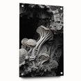 Large abstract wall art on acrylic glass featuring swirls of blue and gray, ideal for modern bedroom or dining room decor.
