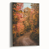 Framed canvas depicting a vintage landscape art painting featuring colorful autumn trees on a black background.