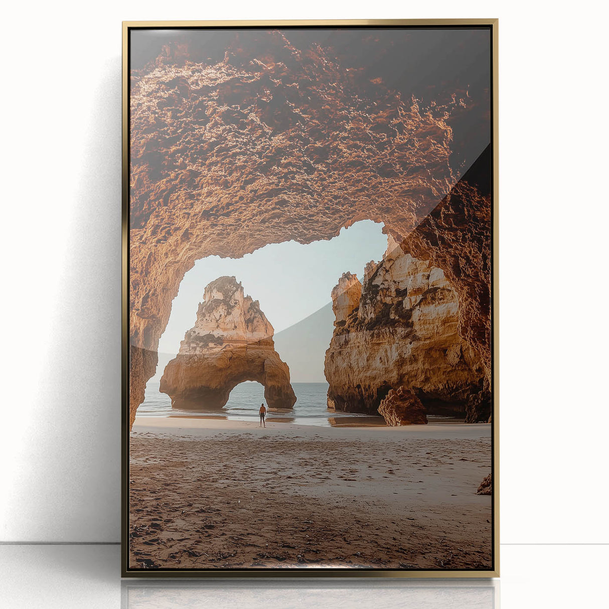 Framed acrylic artwork showcasing a stunning landscape with intricate cave formations and a shimmering gold front, ideal for contemporary home decor.
