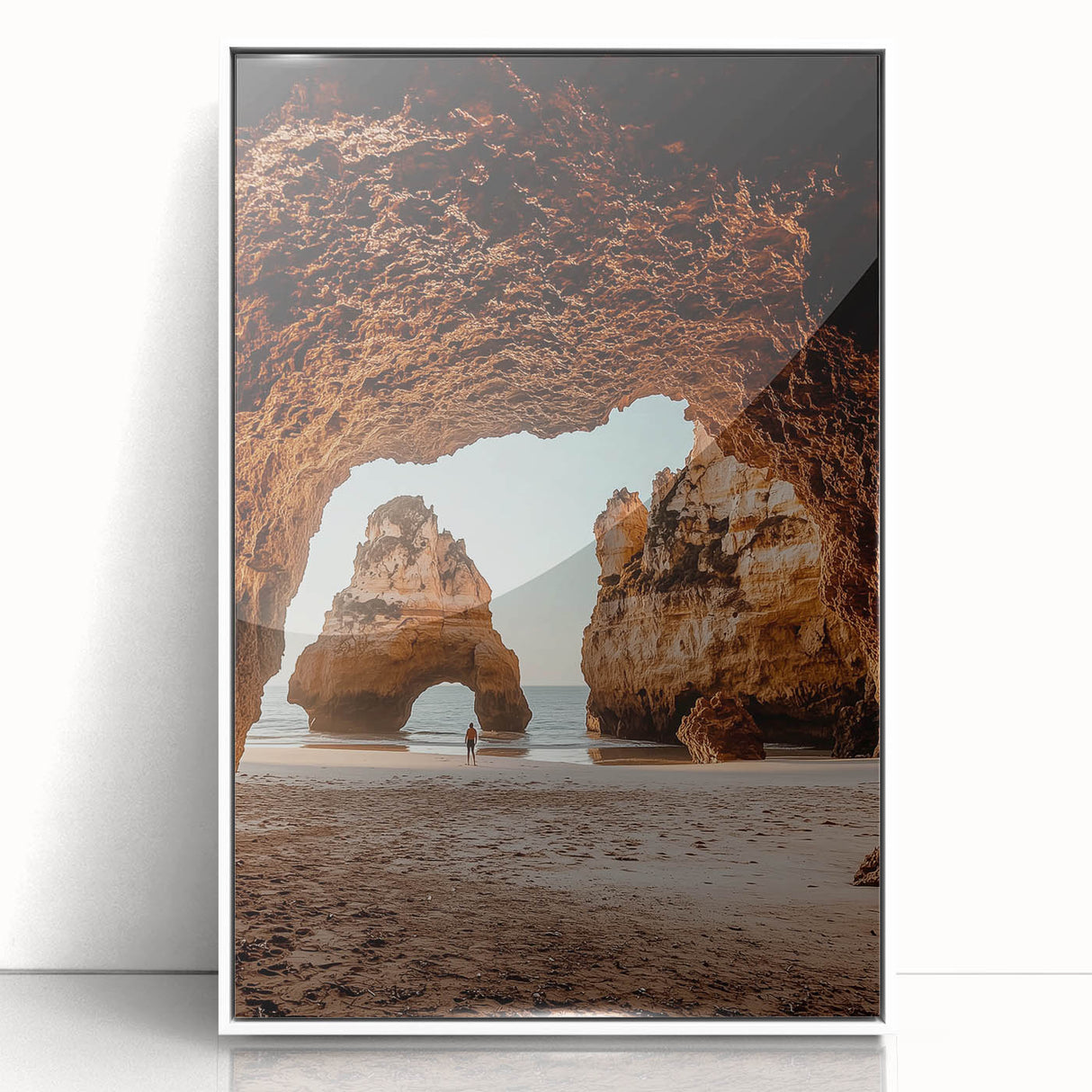 Framed acrylic artwork showcasing a stunning landscape with intricate cave formations, presented in a sleek white frame, ideal for modern home decor.