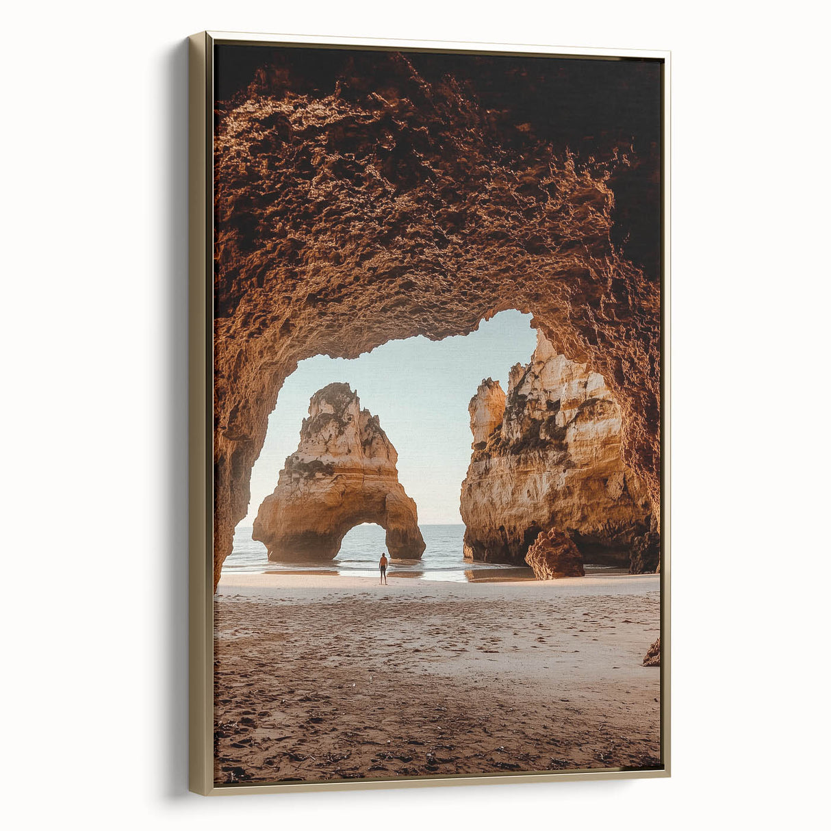 Framed canvas artwork showcasing a stunning landscape scene featuring caves, with a gold frame adding elegance. Perfect for enhancing home decor with natural beauty.