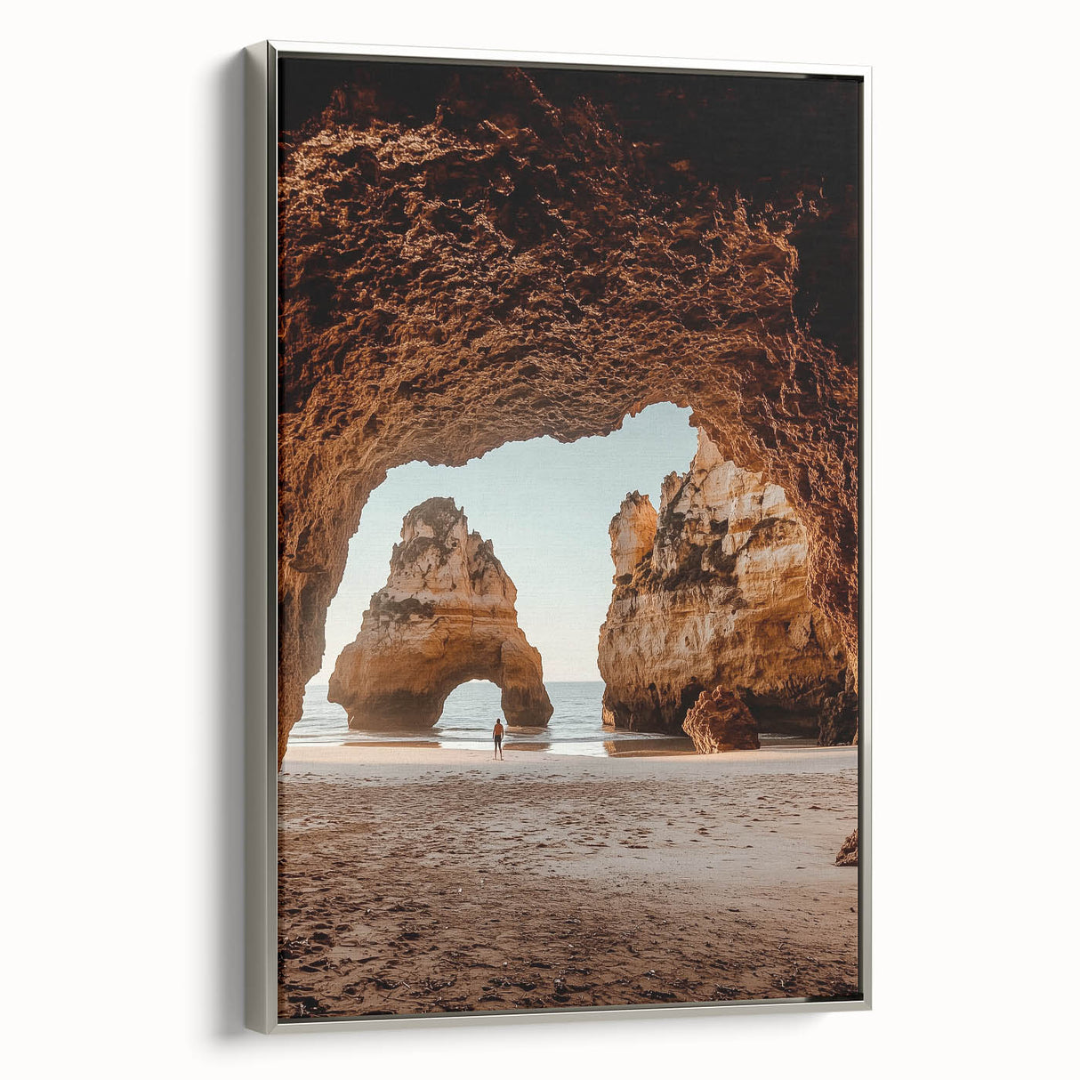 Framed canvas artwork showcasing a stunning landscape of caves, featuring a silver frame and a side view that highlights the vibrant colors and intricate details, perfect for enhancing home decor.