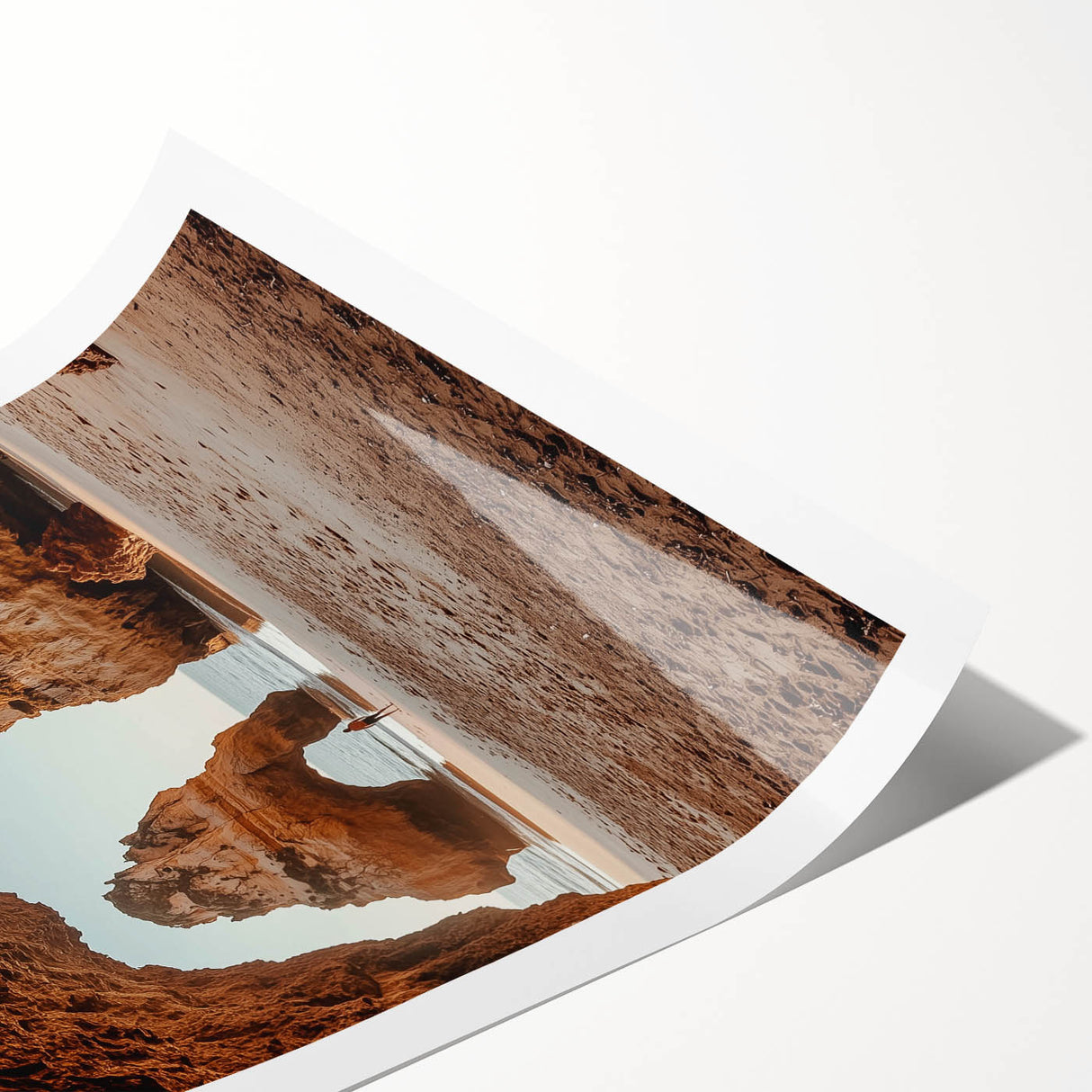 Vibrant rolled landscape print showcasing intricate cave formations with earthy tones, elegantly packaged in a protective cardboard tube for art enthusiasts.