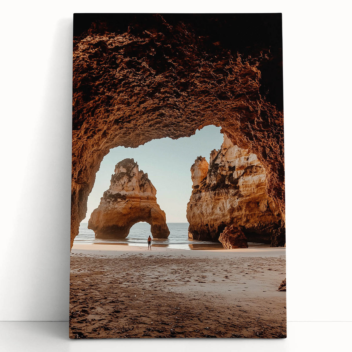 Stretched canvas art depicting a serene landscape with caves, showcasing earthy tones and intricate details, ideal for home decor or office ambiance.