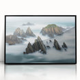 Framed acrylic artwork depicting dramatic cliffs against a vibrant sunset, showcasing deep blues and warm oranges, perfect for modern home decor.