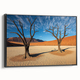 Framed canvas artwork showcasing a stunning desert landscape with vibrant colors and intricate details, featuring a sleek black frame, perfect for home decor.
