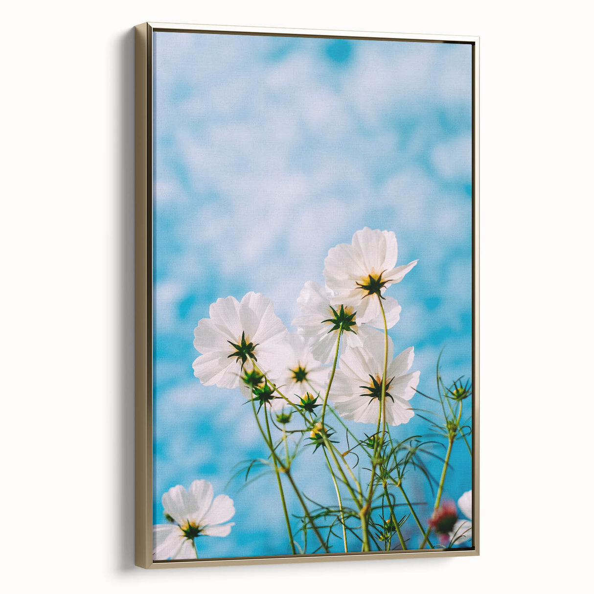 Framed canvas featuring a vintage-style landscape painting with spring motifs in gold and black tones.
