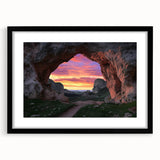 Framed landscape artwork showcasing an intricate cave scene with a black mat and sleek black frame, perfect for modern home decor and art enthusiasts.
