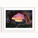 Framed landscape artwork depicting a serene cave scene with a white matting, perfect for home decor or office spaces, showcasing natural beauty and tranquility.