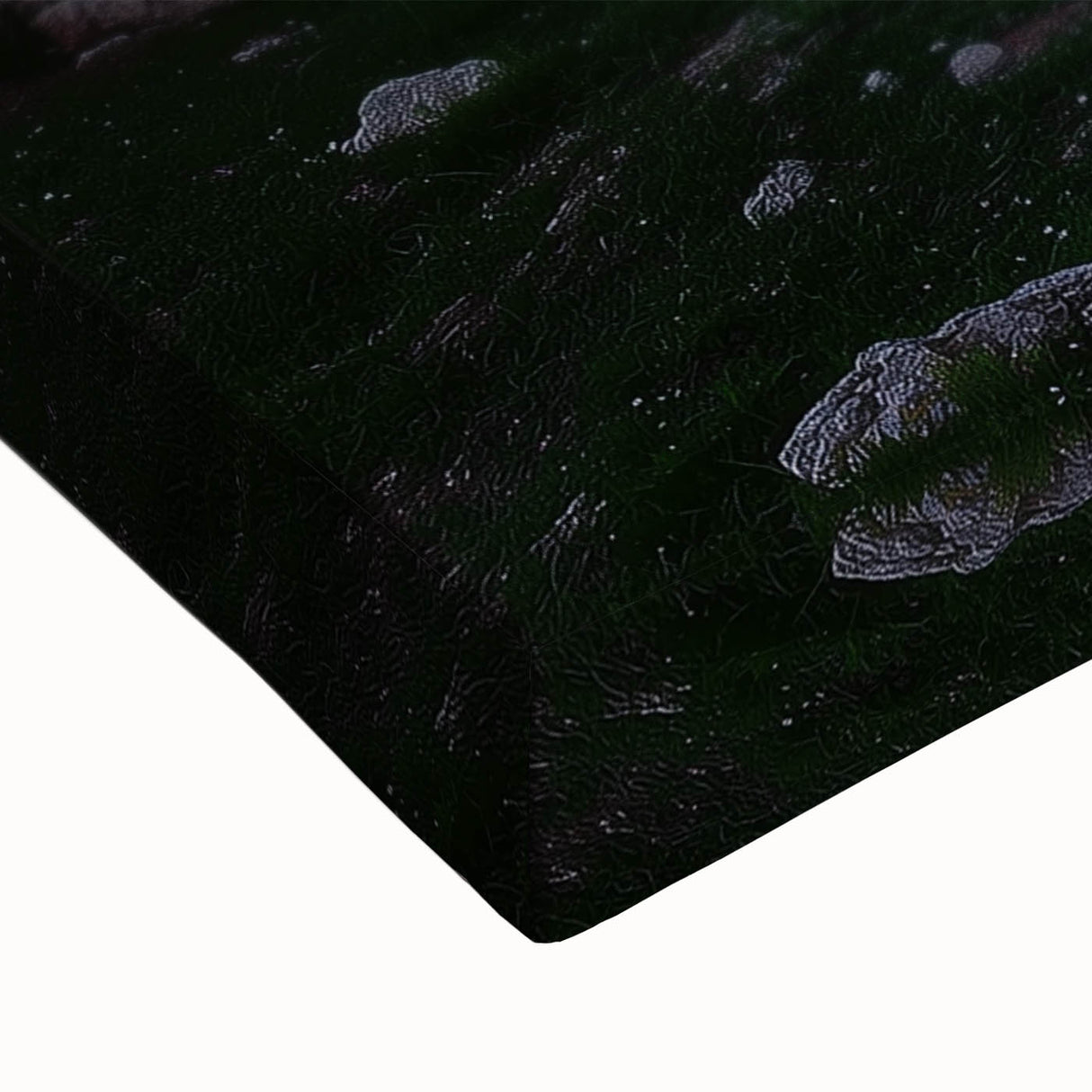 Close-up of a stretched canvas artwork depicting a vibrant landscape with caves, showcasing rich colors and intricate details, perfect for home decor.
