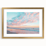 Elegant gold-framed landscape artwork depicting serene beaches at sunset, showcasing soft pastel colors and a stylish mat, perfect for home decor enhancement.