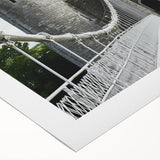Rolled canvas artwork depicting a stunning landscape with a majestic castle surrounded by lush greenery, ideal for home decor. Packaged securely in a protective cardboard tube for safe shipping.