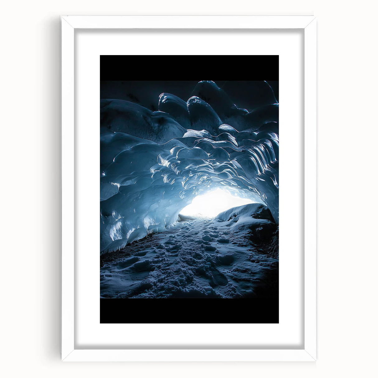 Framed landscape artwork depicting a serene cave scene, featuring earthy tones and intricate details, presented with a white mat for an elegant finish.