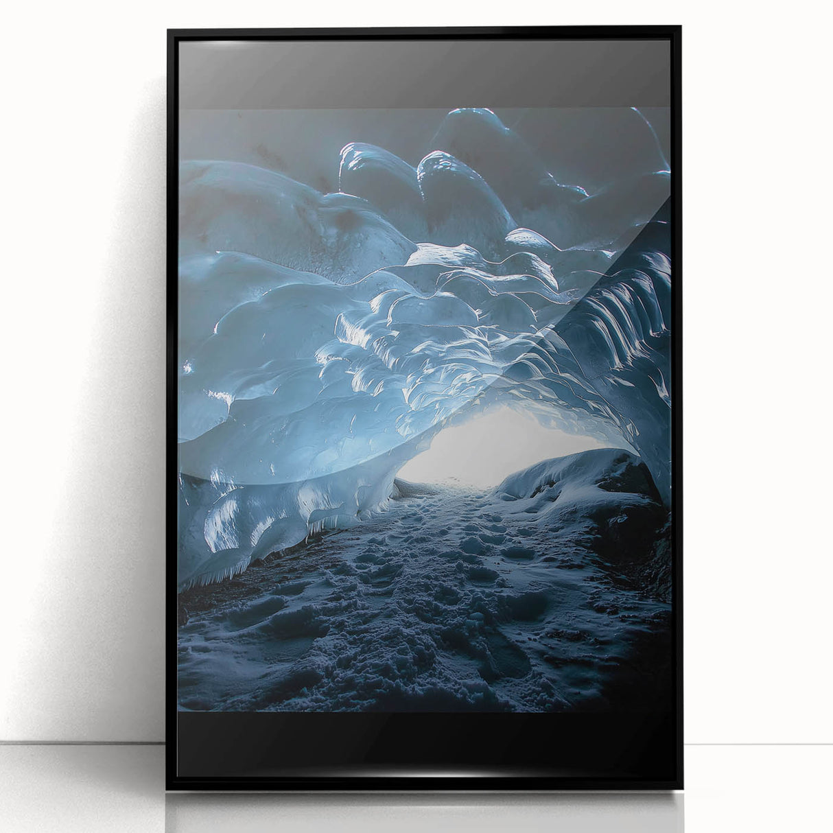 Framed acrylic artwork showcasing a stunning landscape with caves and dramatic rock formations. The piece features a sleek black frame, enhancing its contemporary appeal and making it an ideal addition to modern home decor. Perfect for art enthusiasts seeking unique wall decor.